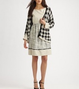 Experience the comfort of this rich knit sweater with allover houndstooth print for a chic look. Open front with single button detailSolid trim in dramatically contrasting tonesRibbed detailing around the cuffs and hemAbout 21 from shoulder to hem61% cotton/39% linenHand washImportedModel shown is 5'10 (177cm) wearing US size Small.