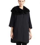 THE LOOKSilky smooth rabbit fur shawl collarTailored from fine wool/angoraConcealed front buttonsThree-quarter length cape sleevesDual front welt pocketsSide slitsTHE FITAbout 36 from shoulder to hemTHE MATERIALWool/angoraTrim: dyed rabbit furFully linedCARE & ORIGINDry clean by fur specialistMade in ItalyFur origin: ChinaModel shown is 5'9 (175cm) wearing US size 4. 