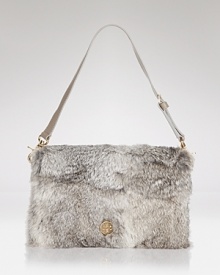 This Tory Burch clutch does evening with an edge. Crafted of rabbit fur with leather trims, it's a look-maker after-hours. This Tory Burch clutch does evening with an edge. Crafted of rabbit fur with leather trims, it's a look-maker after-hours.