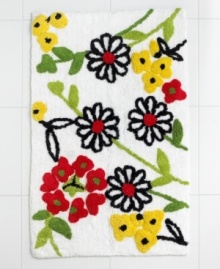 How does your garden grow? Inspired by the fun, carefree designs of Vera, the Wildflower bath rug blooms with tufted, embroidered blossoms in cherry red, green and sunny yellow.