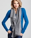 From the boardroom to brunch, this Tory Burch scarf with subtle logo print all over exudes elegance.