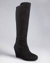 These tall wedge boots by Enzo Angiolini deliver subdued, sculpted, wear-with-everything style. Stretch backs allow for the ideal fit.