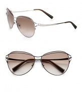 Feminine aviator frames in shiny metal with metal logo temples. Available in gunmetal with grey gradient lens.Metal temples100% UV protectionMade in Italy
