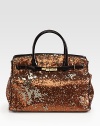 Channel old-Hollywood glamour in this striking sequined silk carryall finished with patent leather trim.Double top handles, 5 dropMagnetic top closureProtective metal feetOne inside zip pocketOne inside leather open pocketSatin lining12½W X 17H X 7½DImported