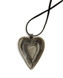 So much to love. The Radiant Heart pendant is full of rich textured detail, hand-cut and hammered in recycled steel by artisans determined to rebuild their lives. After two coats of varnish, each is dried in the hot Caribbean sun. Wear it yourself or give to someone special.