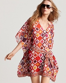 Trina Turk's printed kaftan is a suitcase essential with free spirited appeal. When it's time to take cover, this mini slips over your favorite suit with flat sandals and an armload of bangles. Trina Turk's printed kaftan is a suitcase essential with free spirited appeal. When it's time to take cover, this mini slips over your favorite suit with flat sandals and an armload of bangles.