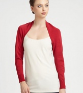An open-front, long-sleeved knit design in a bold hue.Open frontLong cuffed sleevesAbout 10 from shoulder to hem80% rayon/20% nylonDry cleanImported