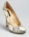 In genuine snakeskin, these Rachel Zoe pumps shine with an almond toe and raised back heel. Effortlessly paired with almost anything, these exotic beauties are a standout staple.