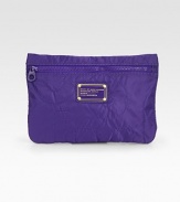 Stash your essentials in this signature-stitch nylon carryall finished with the iconic workwear nameplate.Top zip closureFully lined10½W X 7½H X 1/2DImportedBoxed for giving
