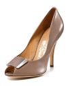 From Italian footwear extraordinaire Salvatore Ferragamo comes a classic pump in elephant grey leather.