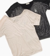 Fun brilliant short sleeve top by Baby Phat has dazzling glitter to use in any occasion.