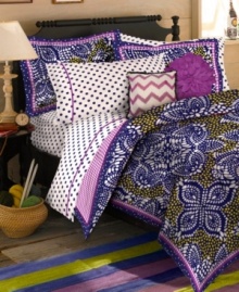 Pair your Samara Batik comforter set from Teen Vogue with this whimsical sheet set, featuring large-scale polka dots in coordinating white and purple hues.