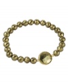 Glitz & glamour. Faceted pyrite beads (99 ct. t.w.) reflect the light on this sparkling 18k gold over sterling silver bracelet. Bracelet stretches to fit wrist. Approximate length: 7-1/2 inches.