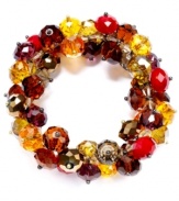 Clusters of fall colors for the season! Slip on c.A.K.e. by Ali Khan's stretchable bracelet, with autumn-inspired color glass beads. Crafted in gold tone mixed metal. Approximate diameter: 2 inches.