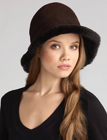 Soft and warm shearling fleece inside, naturally weather-resistant sheepskin outside makes this a stylish choice whatever the weather! Crown, about 22½ diameter Dyed Spanish shearling; dry clean Made in USA Fur origin: Spain Soft and warm shearling fleece inside, naturally weather-resistant sheepskin outside makes this a stylish choice whatever the weather! Crown, about 22½ diameter Dyed Spanish shearling; dry clean Made in USA Fur origin: Spain