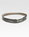 Skinny leather wrap belt with palladium hardware and stirrup buckle. Detachable piece with notch closure About ¾ wide Made in Italy 