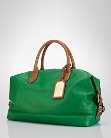 Take heritage-inspired style with you when you go. Lauren by Ralph Lauren's leather duffel is ideal for trains, planes and autos, finished with gleaming hardware and sturdy handles. Take heritage-inspired style with you when you go. Lauren by Ralph Lauren's leather duffel is ideal for trains, planes and autos, finished with gleaming hardware and sturdy handles.
