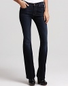 A high waist lends sophistication to these 7 For All Mankind bootcut jeans, rendered in a subtly faded dark wash.