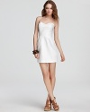 Flaunt your fabulous sense of style in this white Rebecca Minkoff party dress featuring an alluring bustier bodice and allover eyelet. Refreshingly feminine, this one of spring's IT frocks for the season.