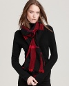 Wrap yourself in iconic style with a timeless Burberry scarf.