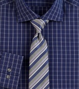 An elegant mix of stripes sharpen a classic silk tie woven in Italy. About 3 wideSilkDry cleanMade in Italy