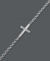 A modern update on the traditional cross. Studio Silver adds a simple twist by turning a symbolic cross charm on its side. Crafted in sterling silver with sparkling crystal accents and rhodium plating to prevent tarnishing. Approximate length: 7-1/2 inches.