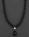 A dramatic black onyx and fresh water pearl necklace with faceted teardrop onyx centerpiece.