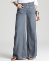 Free People's ultra-wide leg jeans play up the '70s trend with abandon boasting front and back patch pockets for a truly retro look.