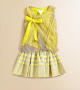 Airy tulle overlay and vibrant tie detail create a twisted, voluminous illusion, lending a little romantic touch to this plush knit.ScoopneckSleevelessPullover styleBodice has twist detail with tape tieAsymmetrical hemShell: polyesterLining: cottonHand washImported