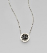 From the Classic Chain Collection. A graceful sterling silver chain holds a delicate round drop set with dramatic black sapphires.Black sapphiresSterling silverChain length, about 16Drop diameter, about ¼Lobster claspImported