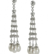 Show off your bold side. These drop earrings feature a stylish silhouette with cultured freshwater pearls (6-6-1/2 mm) adding an elegant touch. Crafted from sterling silver with a rhodium finish. Approximate drop length: 2-1/5 inches. Approximate drop width: 1/2 inch.