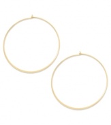 A classic touch. Studio Silver's endless hoop earrings, set in 18k gold over sterling silver, offer a timeless look that's quite elegant. Approximate diameter: 2-1/4 inches.