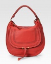 EXCLUSIVELY AT SAKS IN RUBY. A slouchy silhouette of sumptuous leather, finished with tonal strips and a tennis-wrapped handle.Top handle, 7 drop Top-zip closure Hidden open pocket under flap One inside zip pocket One cell phone pocket Cotton lining 15W X 14½H X 4D Made in Italy