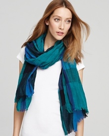 In a moody dark peacock palette, this Burberry scarf lends effortless cool, season after season. In a moody dark peacock palette, this Burberry scarf lends effortless cool, season after season.