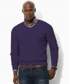 A long-sleeved sweater is designed in luxurious jersey-knit Pima cotton with a preppy V-neckline for refined, masculine polish.