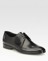 Classic lace-up oxford with a beveled heel, rendered in smooth, supple Italian leather.Leather upperLeather liningPadded insoleRubber soleMade in Italy