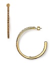 MARC BY MARC JACOBS' hoops are a have-to-have it twist on a classic. With a crystal-encrusted rim, these earrings are easy-glam worn at night with a mini and glitter heels.