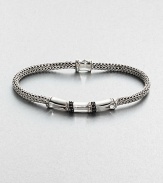 Braided sterling silver bracelet, handsomely accented by a radiant black sapphire closure. .Sterling silver/black sappphireAbout 3 diam.Imported
