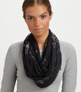 A muted skull print gets lost amongst flying dandelions on this ultra-soft pashmina wrap with eyelash fringe.90% modal/10% cashmereAbout 55 X 55Dry cleanMade in Italy