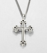 A traditional cross pendant rendered in fine sterling silver with a curb link chain necklace exudes timeless appeal.Sterling silverLength about 24Lobster claspMade in USA