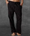 A relaxed-fitting pajama pant is crafted from soft cotton flannel with allover printed ponies for iconic style.