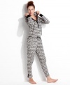 Warm and snuggly from head to toe. Kensie's hooded jumpsuit features contrasting cuffs and placket with a snap closure.