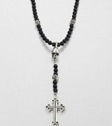 A traditional cross pendant is suspended from an impeccable strand of black onyx beads with sculpted skull detail for an edgy, modern update.Sterling silverBlack onyxLength about 26Toggle claspMade in USA