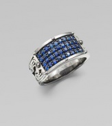 A tapered design in rhodium plated sterling silver is defined by four rows of tiny blue sapphires.Sterling silverBlue sapphiresAbout 1½ diamImported