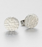 From the Palu Collection. Inspired by the mottled surface of the moon, this design is hammered by hand to create its intriguing undulating surface.Sterling silverSwivel backMade in Bali