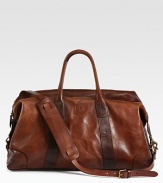 An ideal size for travel, this heritage duffel is rendered in durable leather with a removable reinforced leather shoulder strap for versatile on-the-go styling.Zip closureDouble top handlesAdjustable, removable shoulder strapInterior zip pocketEmbossed signature leather luggage tagCotton twill liningLeather24W x 12H x 10DImported