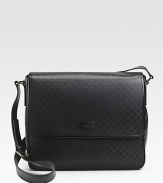Diamante leather with leather trim.Flap closure with magnetic snapAdjustable shoulder strapLight gold hardwareInterior zip, cell phone, PDA pockets14.2W X 13H X 4DMade in Italy