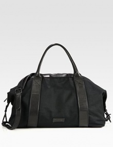 This spacious, versatile bag has an array of pockets for all of your essentials, structured in a sturdy canvas with leather trim for a refined finish.Zip closureTop handlesRemovable shoulder strapExterior, interior zip pocketsCotton liningCanvas/leather20W x 10 x 9DImported This spacious, versatile bag has an array of pockets for all of your essentials, structured in a sturdy canvas with leather trim for a refined finish.Zip closureTop handlesRemovable shoulder strapExterior, interior zip pocketsCotton liningCanvas/leather20W x 10 x 9DImported