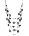 Show your true stripes. Haskell's elusive illusion necklace features five chic rows of black striped squares, black and clear cherry beads, and small crystal accents. Crafted in silver tone mixed metal. Approximate length: 18 inches + 3-inch extender. Approximate drop: 4-3/4 inches.