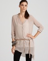New-season femininity meets exceptional luxury in this sheer Helmet Lang shirt with a deconstructed, asymmetric hem. Wear it belted with streamlined ponte leggings.
